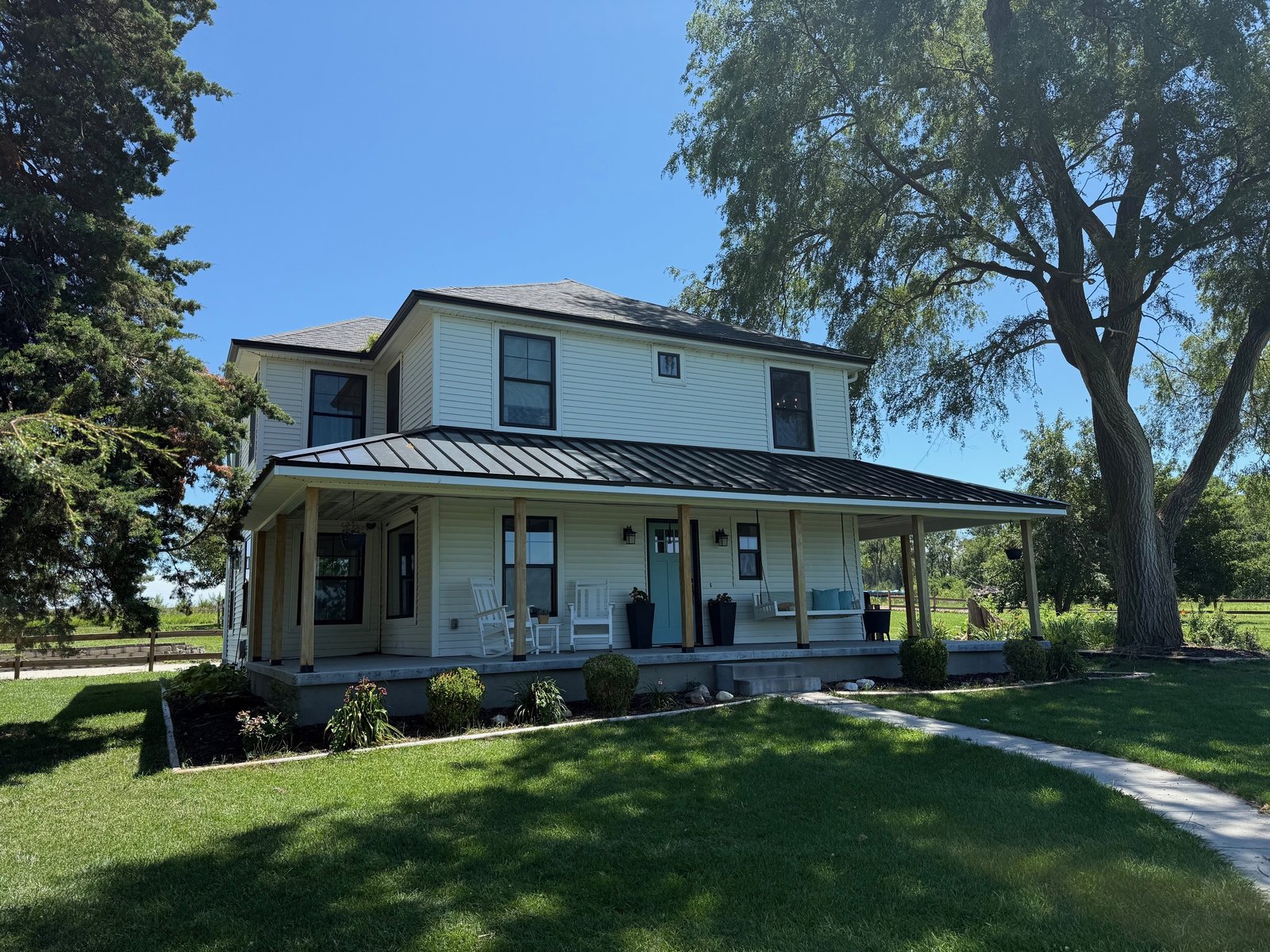 Hudson's Hill farmhouse with wraparound porch